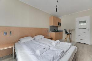 Posteľ alebo postele v izbe v ubytovaní Apartments Old Town Angielska Grobla & by Noclegi Renters
