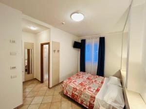 Кровать или кровати в номере Hotel Aurora