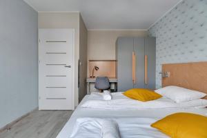 Posteľ alebo postele v izbe v ubytovaní Apartments Old Town Angielska Grobla & by Noclegi Renters