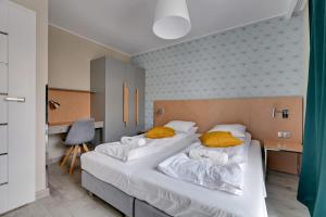 Posteľ alebo postele v izbe v ubytovaní Apartments Old Town Angielska Grobla & by Noclegi Renters