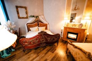 a bedroom with a large bed and a fireplace at Apartment Prenzlauer Berg in Berlin +37 photos