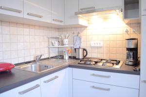 Kuchyň nebo kuchyňský kout v ubytování Jasmina Apartment