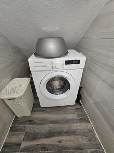 a washer and dryer in a small room at Beach Apartment B in Nea Karvali