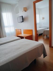 Postel nebo postele na pokoji v ubytování Torrejoven