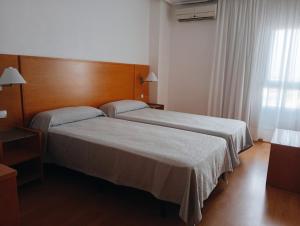 Postel nebo postele na pokoji v ubytování Torrejoven
