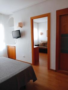 Postel nebo postele na pokoji v ubytování Torrejoven