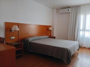 Postel nebo postele na pokoji v ubytování Torrejoven