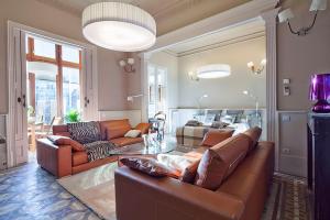 a living room with a couch and a table at My Space Barcelona Rambla Catalunya Center in Barcelona