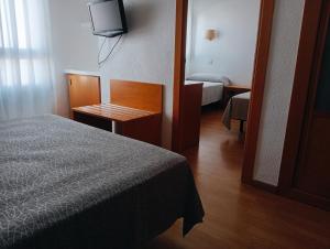Postel nebo postele na pokoji v ubytování Torrejoven