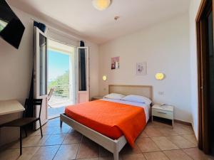Кровать или кровати в номере Hotel Aurora