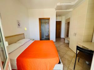 Кровать или кровати в номере Hotel Aurora