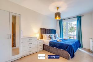a bedroom with a bed and a dresser and a window at 7Nights Special l Modern Apartment l Sleeps Up to 8 l Cozy 2 Bedrooms Apt By Capital Retreats Short Lets & Serviced Accommodation in Colindale With Free WIFI l Flat 4 in Colindale