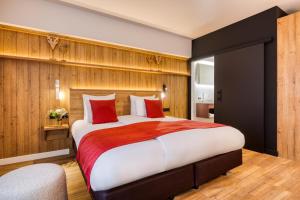 Ліжко або ліжка в номері Hotel du Commerce