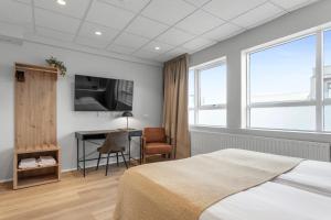 Postel nebo postele na pokoji v ubytování Alva Hotel Brautarholt