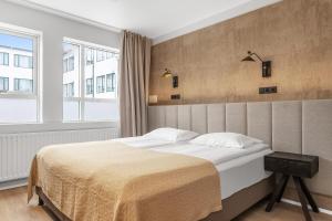 Postel nebo postele na pokoji v ubytování Alva Hotel Brautarholt