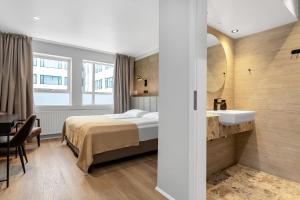 Postel nebo postele na pokoji v ubytování Alva Hotel Brautarholt