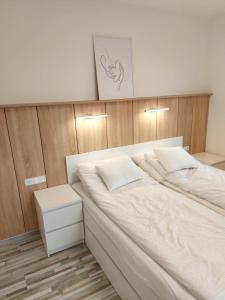 Ένα ή περισσότερα κρεβάτια σε δωμάτιο στο Penthouse Apartman