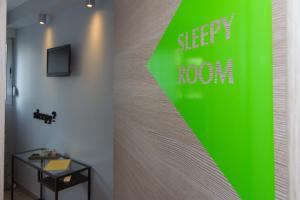a green sign on a wall in a room at B&B Vibe in Split