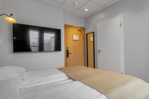 Postel nebo postele na pokoji v ubytování Alva Hotel Brautarholt
