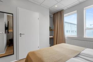 Postel nebo postele na pokoji v ubytování Alva Hotel Brautarholt