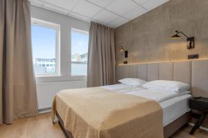 Postel nebo postele na pokoji v ubytování Alva Hotel Brautarholt