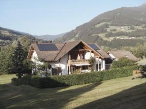 a house with solar panels on the roof at Alpenquartier Montafon in Tschagguns