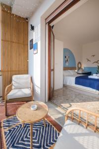 a living room with a bed and a table at Casita de Luna- Affittacamere Bologna in Bologna