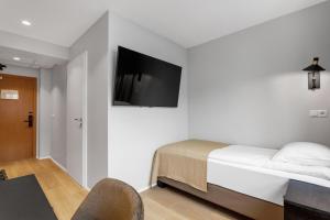Postel nebo postele na pokoji v ubytování Alva Hotel Brautarholt