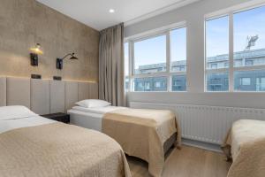 Postel nebo postele na pokoji v ubytování Alva Hotel Brautarholt
