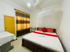 Letto o letti in una camera di Pawana Rest