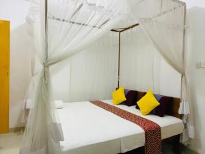 Postel nebo postele na pokoji v ubytování Pawana Rest + 23 fotografií