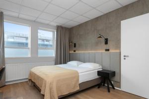 Postel nebo postele na pokoji v ubytování Alva Hotel Brautarholt
