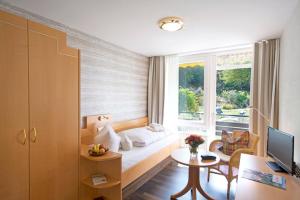 Postel nebo postele na pokoji v ubytování Hotel Burgblick