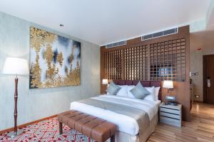Letto o letti in una camera di Hotel Ashwatth
