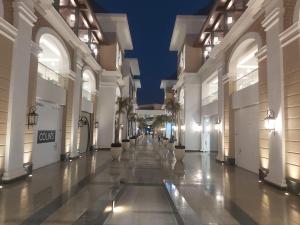 an empty hallway of a shopping mall at night at Sokon Residence Madinaty in Madinaty
