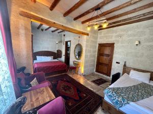 A bed or beds in a room at Avanos Suites Még 20 kép