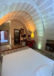 A bed or beds in a room at Avanos Suites