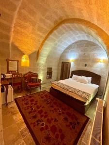 A bed or beds in a room at Avanos Suites