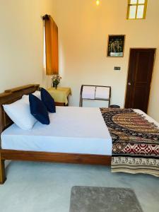 Postel nebo postele na pokoji v ubytování Mahesh Homestay + 9 fotografií