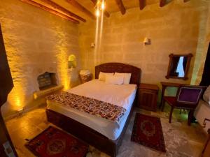 A bed or beds in a room at Avanos Suites