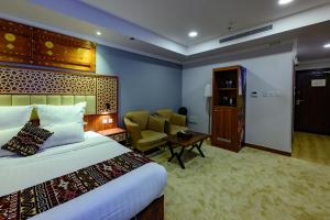 Postel nebo postele na pokoji v ubytování Zaman Homeland Hotel