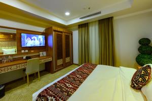 TV a/nebo společenská místnost v ubytování Zaman Homeland Hotel