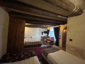 A bed or beds in a room at Avanos Suites