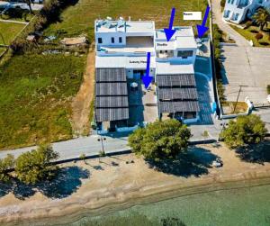 an overhead view of a house with solar panels on it at Filina's Room 1 in Maltezana