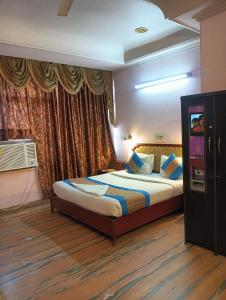 Postel nebo postele na pokoji v ubytování Hotel Classic Inn Near Gaffar Market