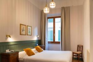A bed or beds in a room at Affittacamere Zanobi 45
