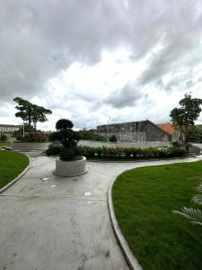 a walkway in a park with a building at Barsa City by Eleanor in Seturan