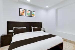 Postel nebo postele na pokoji v ubytování Hotel O Grand Heights