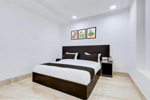 Postel nebo postele na pokoji v ubytování Hotel O Grand Heights