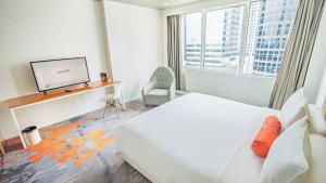 Katil atau katil-katil dalam bilik di HARRIS Suites fx Sudirman